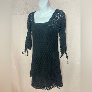 Solitaire black mini dress with mesh overlay